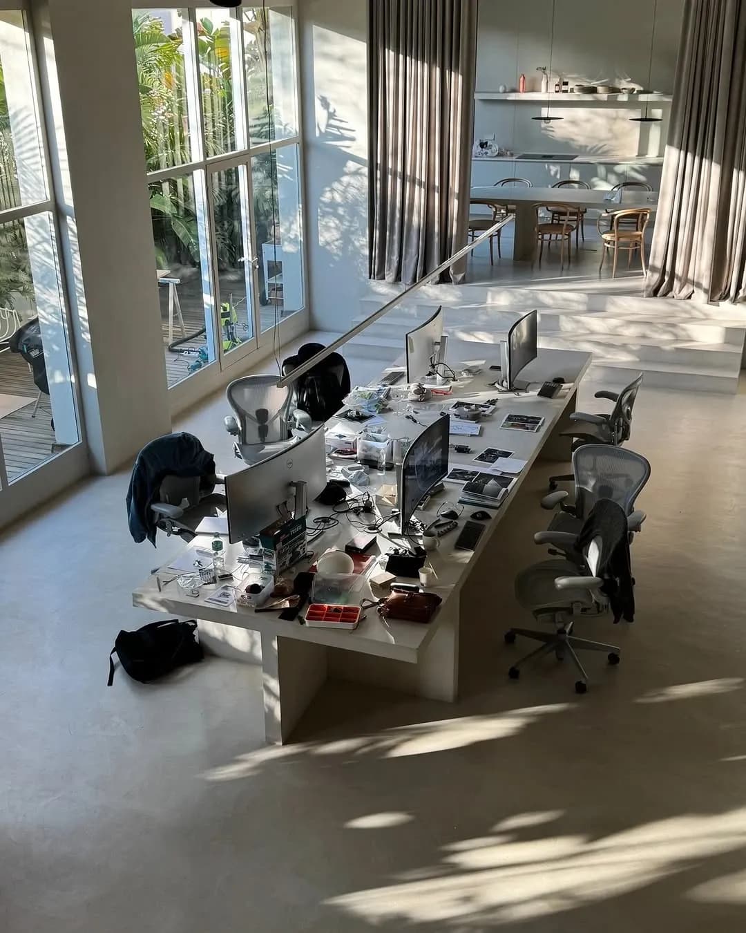 Kendali studio workspace with desks and drawings